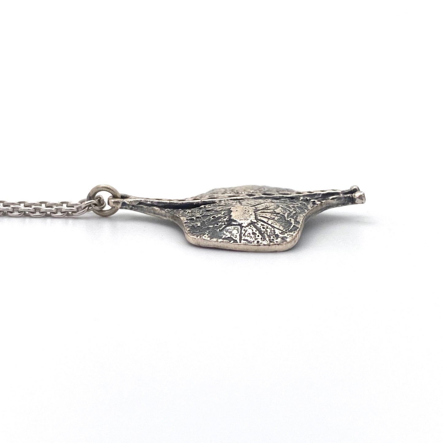 profile Guy Vidal Canada vintage brutalist pewter stingray pendant necklace Canadian Modernist jewelry design