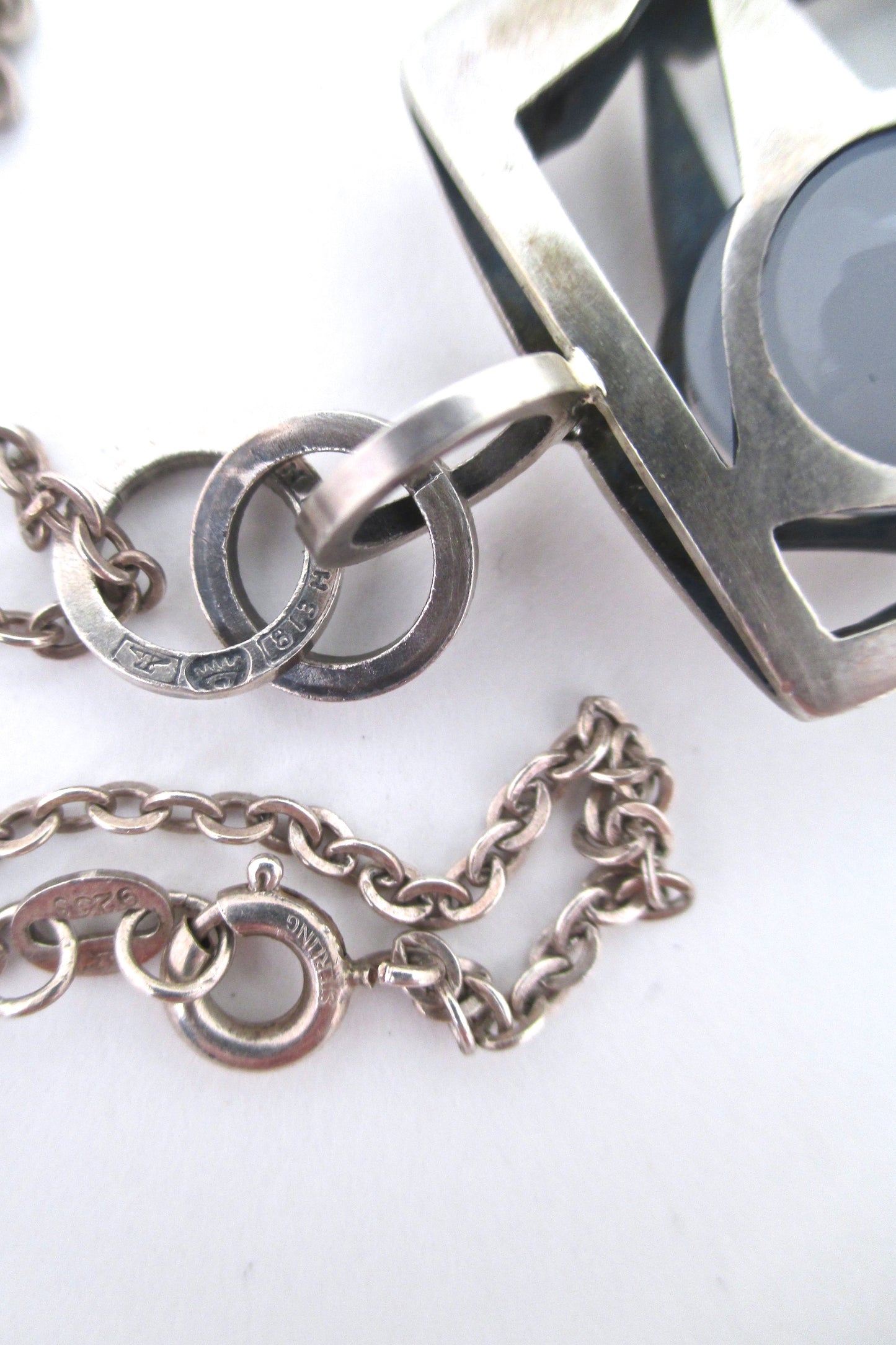 Elis Kauppi caged sphere bird pendant necklace