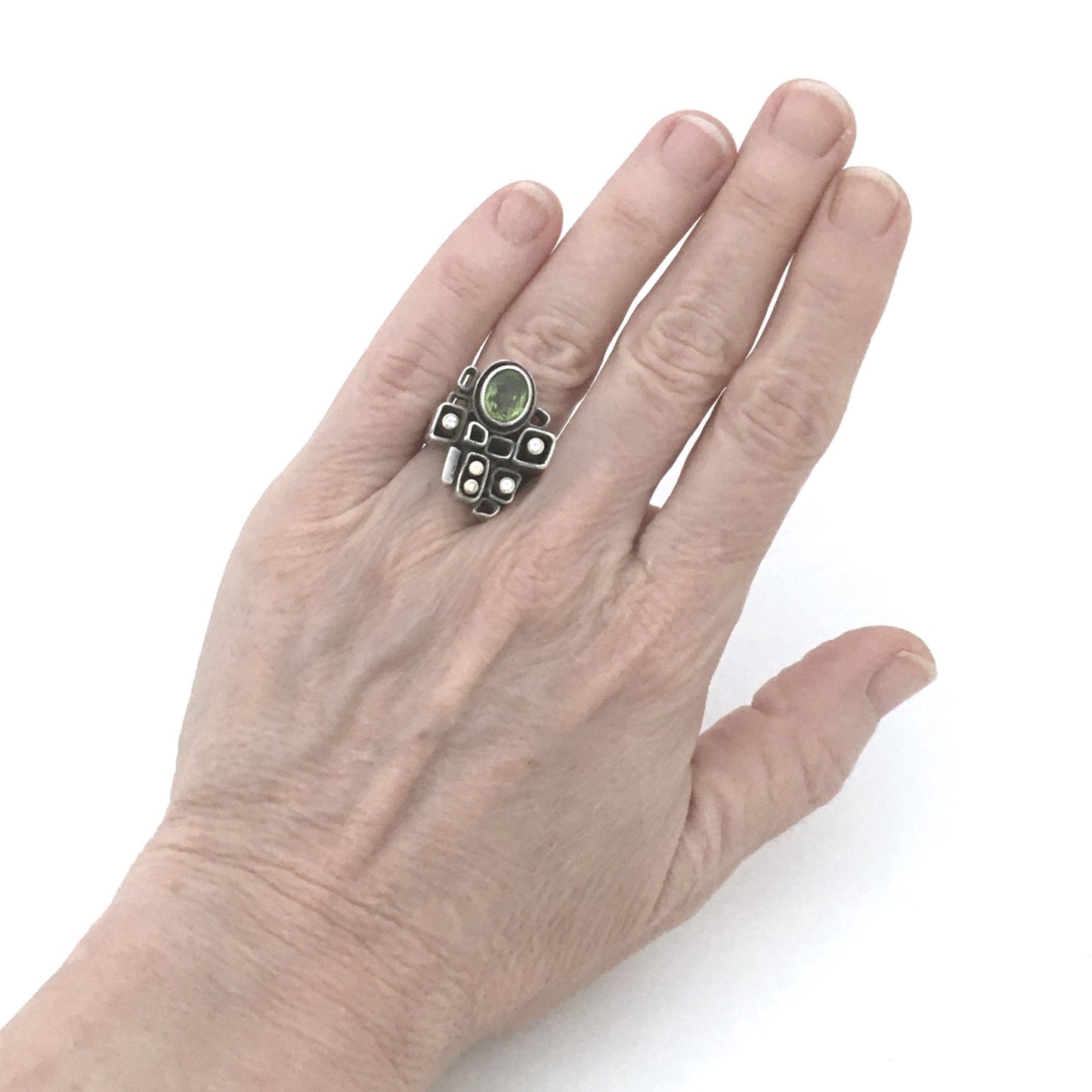 Walter Schluep large sculptural ring ~ gold, peridot & diamonds