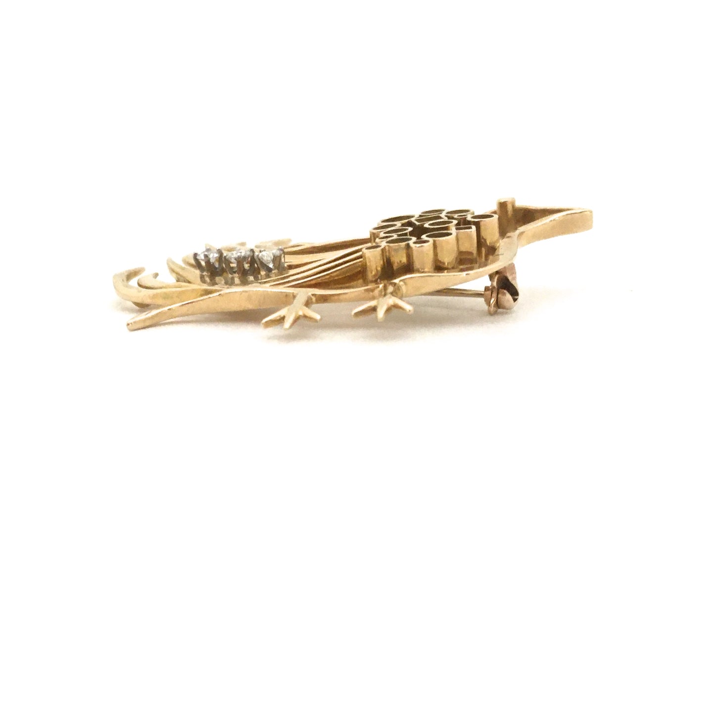 profile Walter Schluep Canada vintage 18k gold diamond bird brooch Canadian Modernist jewelry design