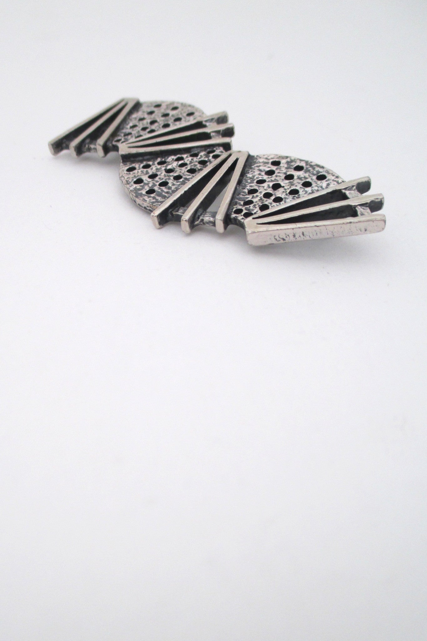 profile Jean-Claude Darveau Canada vintage pop art curves and angles chrome brooch