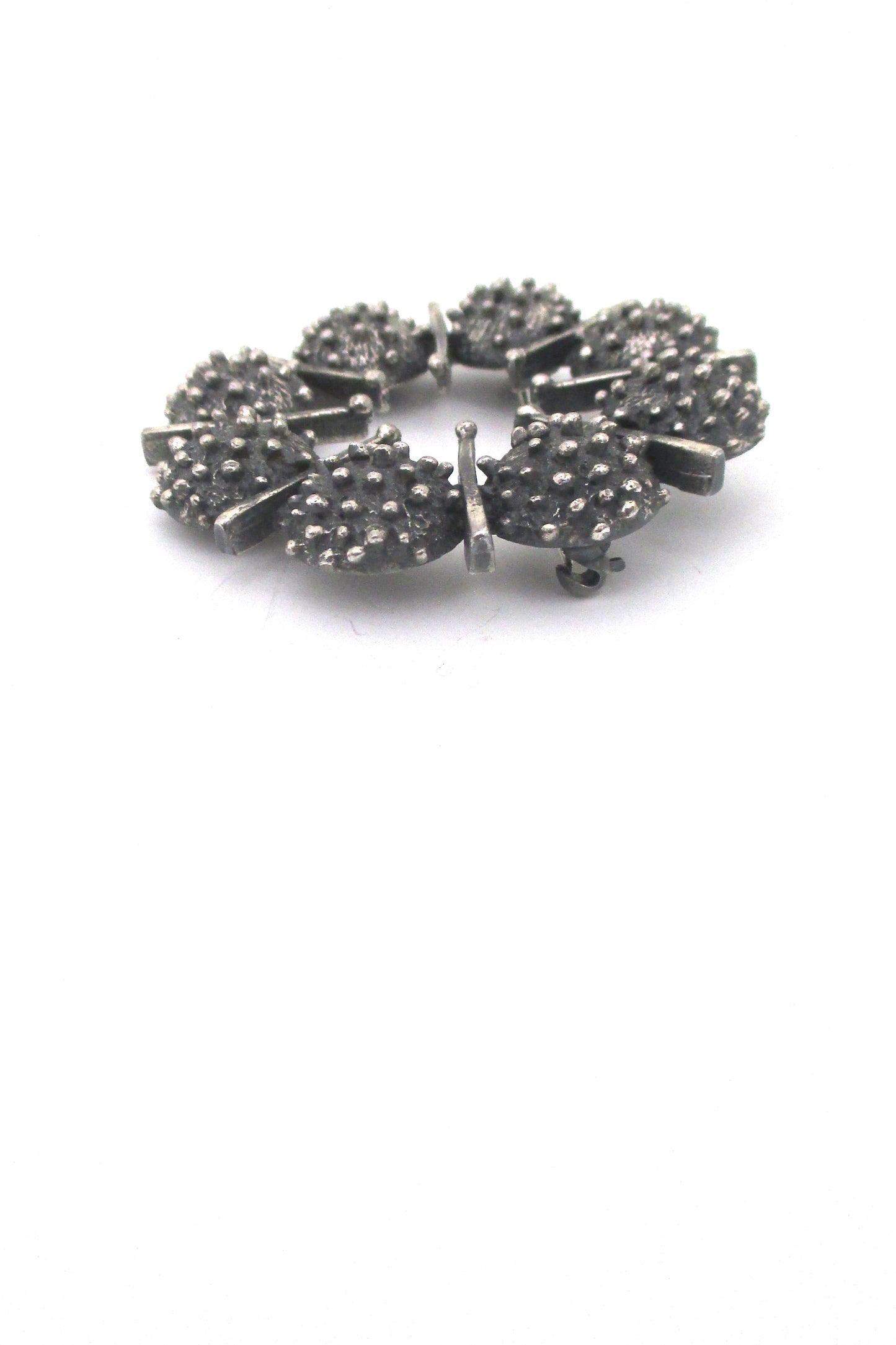 profile Guy Vidal Canada vintage brutalist pewter round openwork brooch