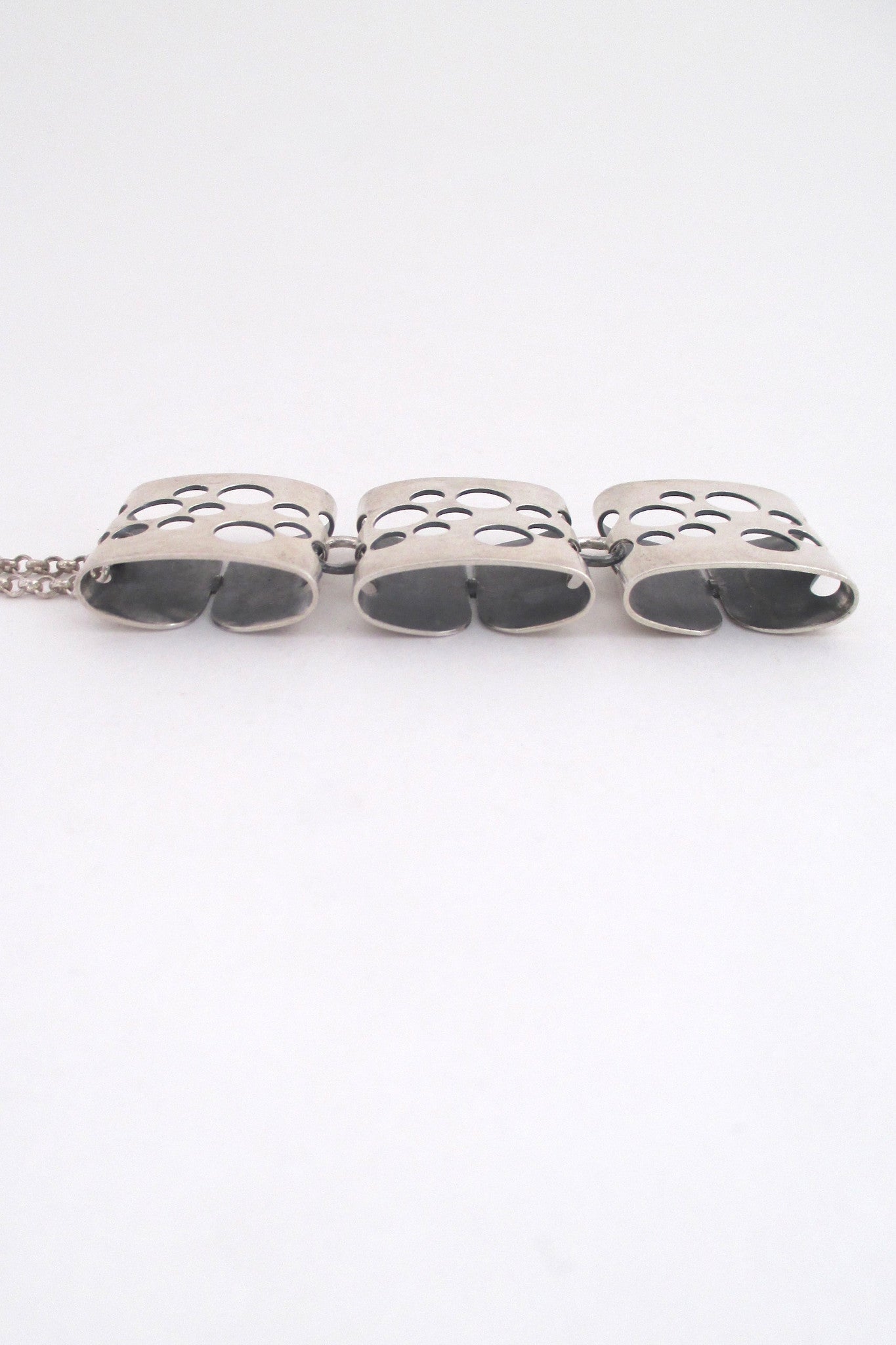 profile Elis Kauppi for Kupittaan Kulta long kinetic pierced silver pendant necklace