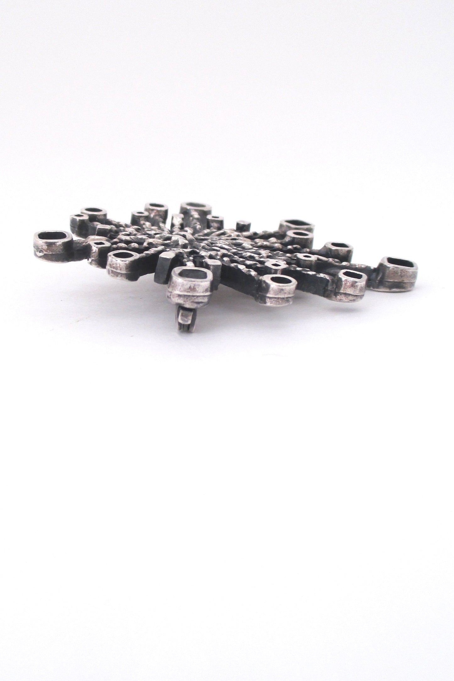 Guy Vidal pewter 'fireworks' brooch