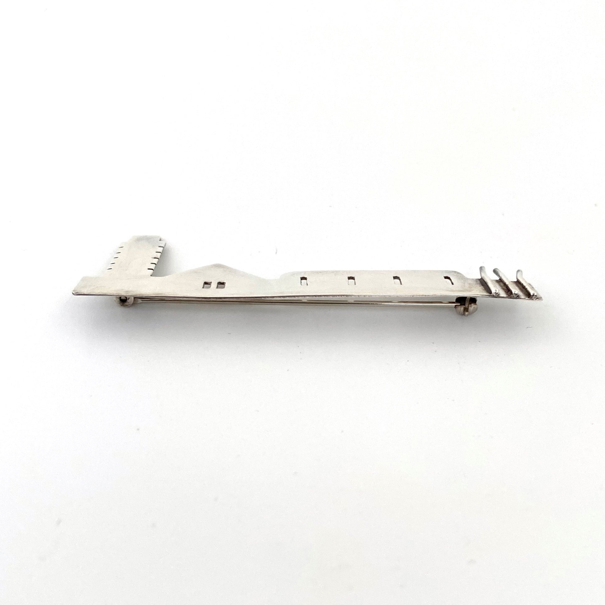 profile Anne Barros Canada vintage silver long building brooch Canadian Modernist jewelry design