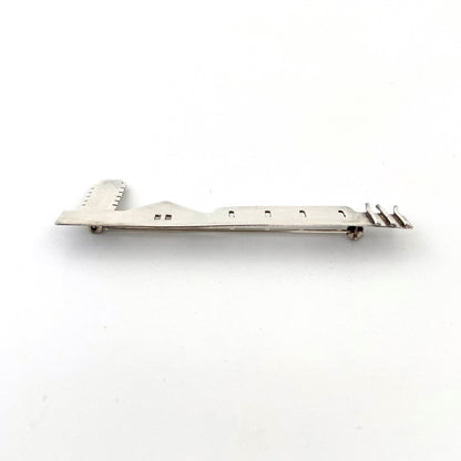 profile Anne Barros Canada vintage silver long building brooch Canadian Modernist jewelry design