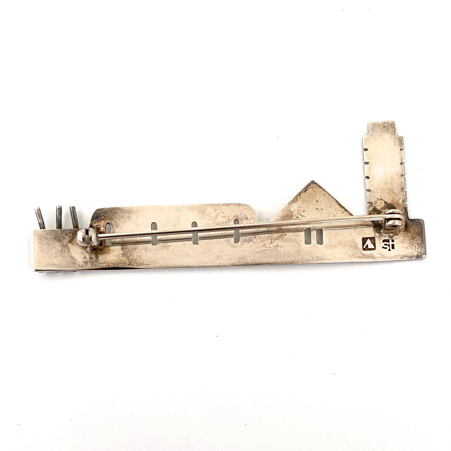 Anne Barros long silver building brooch