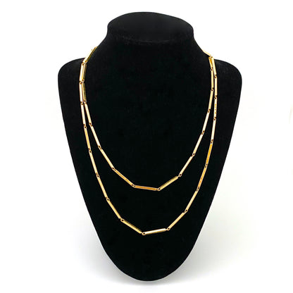 Walter Schluep Canada vintage 18k yellow gold long hammered link chain necklace Modernist art jewelry design on neck stand