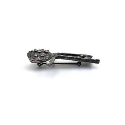 Robert Larin brutalist pewter abstract person brooch
