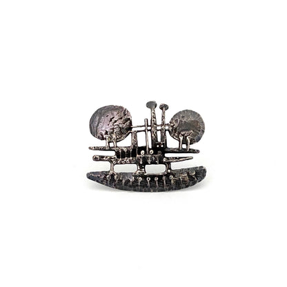 detail vintage brutalist pierced sculptural silver brooch Modernist jewelry design