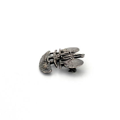 profile vintage brutalist pierced sculptural silver brooch Modernist jewelry design