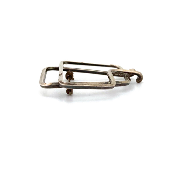 profile Joseph Skinger USA 1911 - 1967 vintage silver openwork brooch American Modernist jewelry design