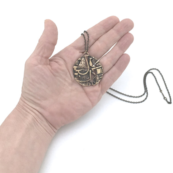 Jorma Laine textured bronze round pendant necklace