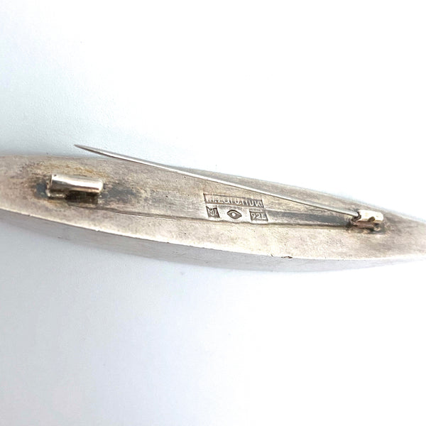 Marcin Zaremski long, sleek silver brooch