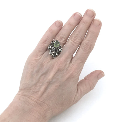 Walter Schluep large sculptural ring ~ gold, peridot & diamonds