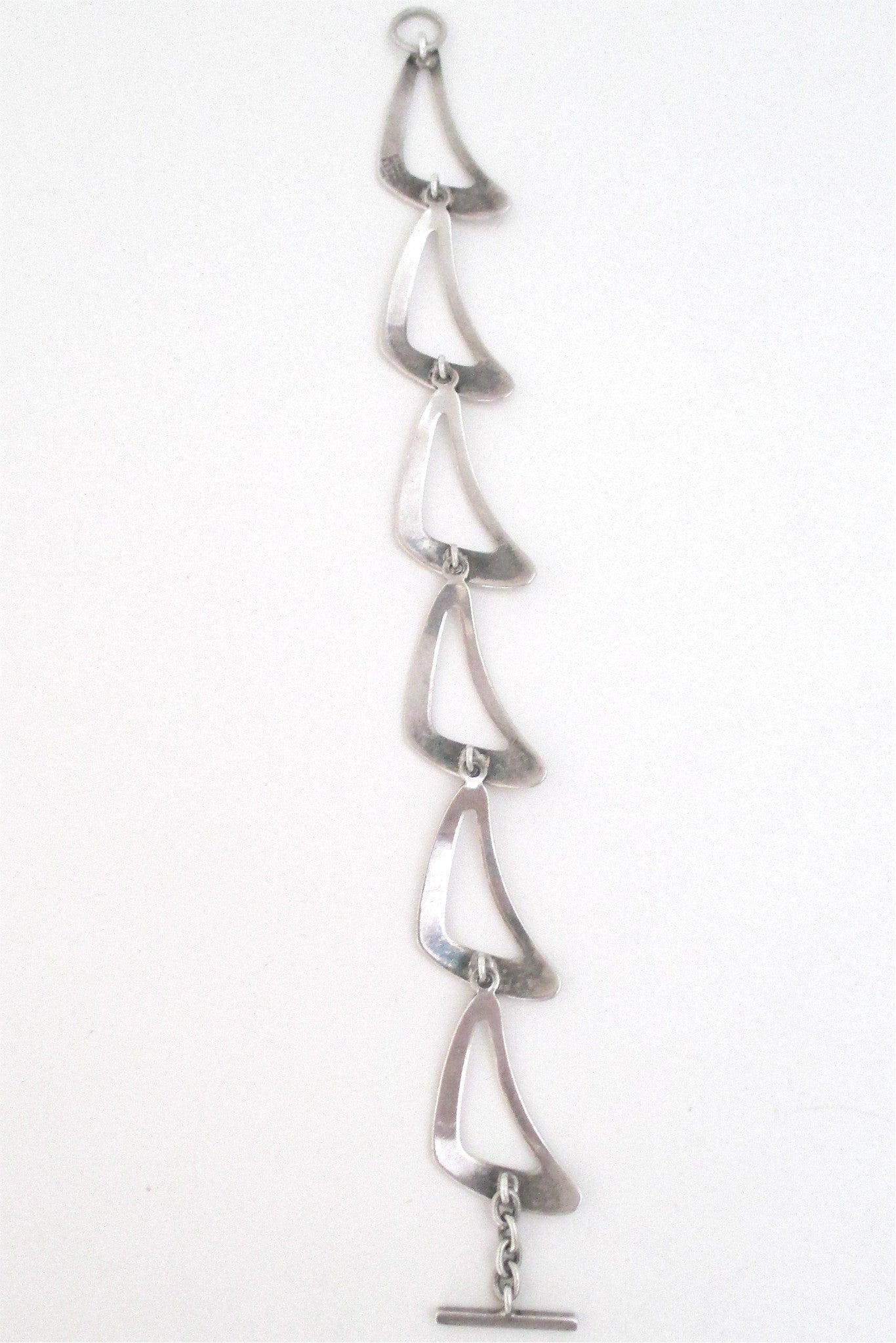 N E From 'boomerang' bracelet