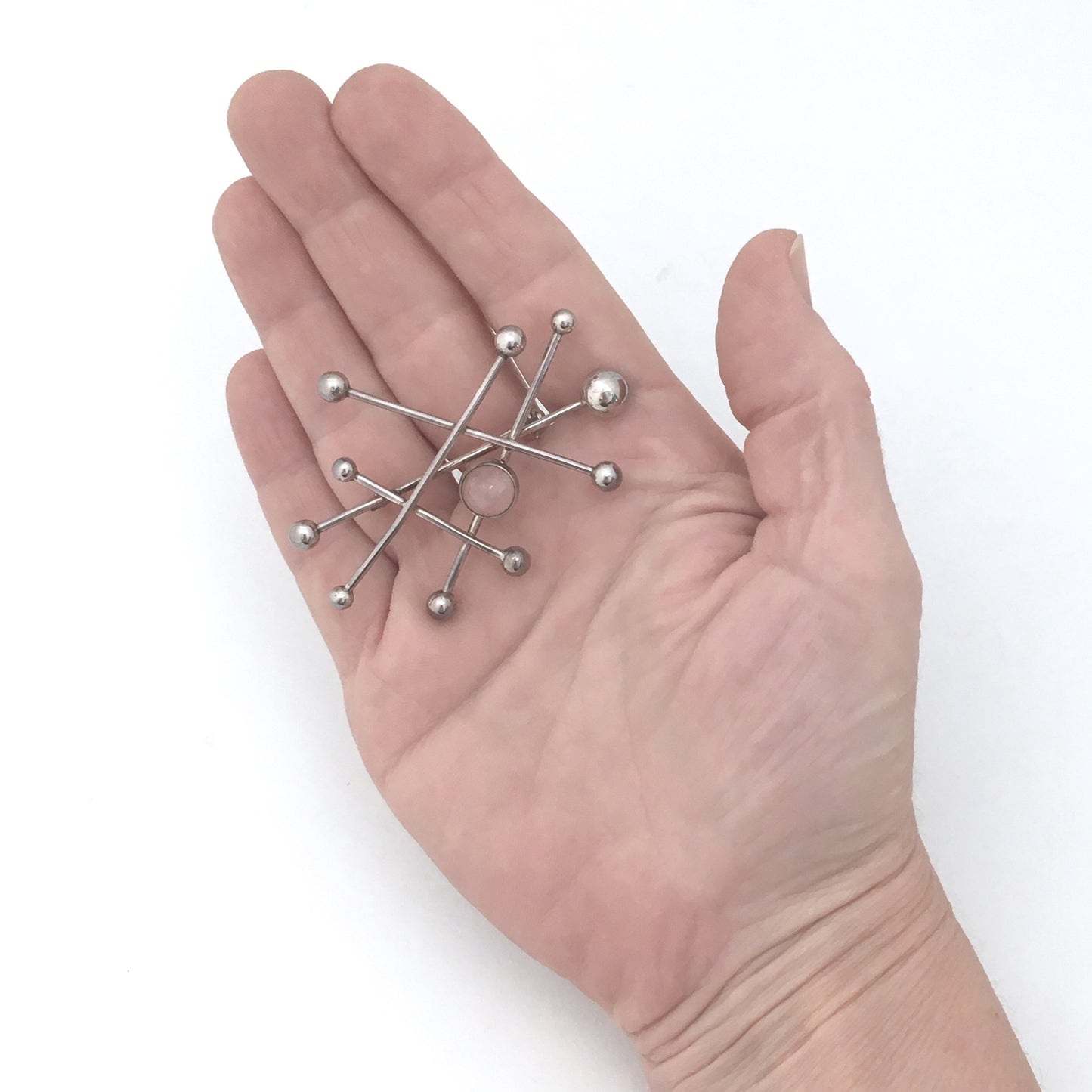 NE From large 'atomic' brooch with rose quartz