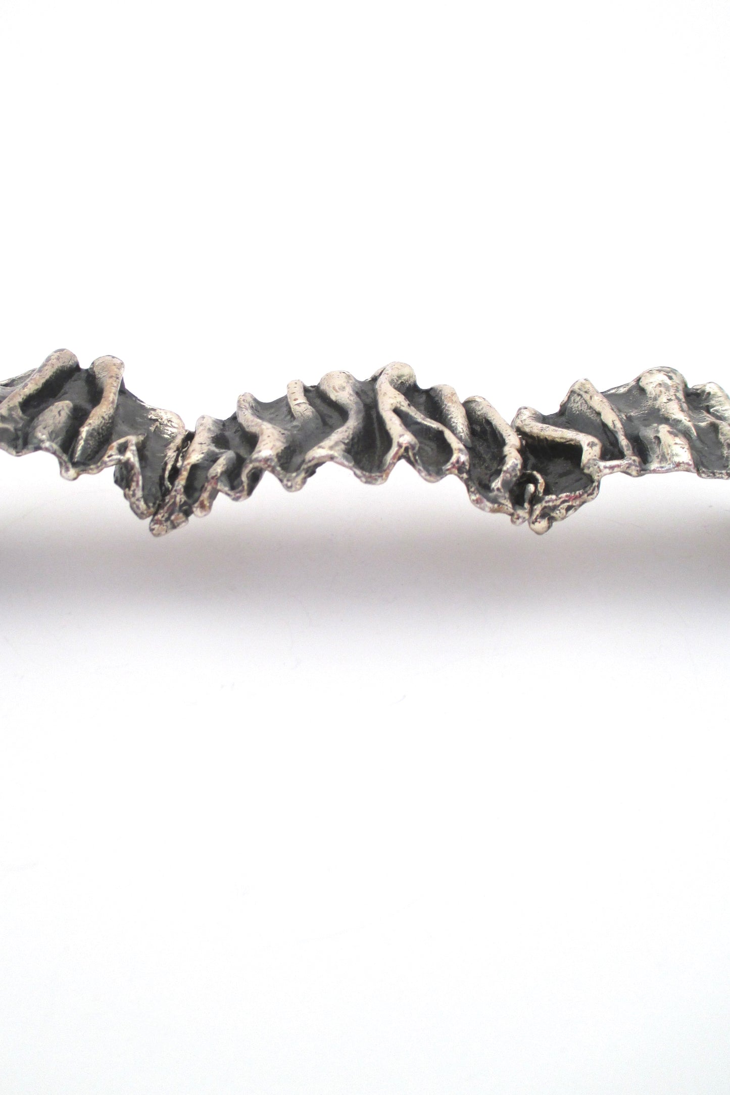 profile Guy Vidal Canada large brutalist pewter gathered folds hinged bracelet