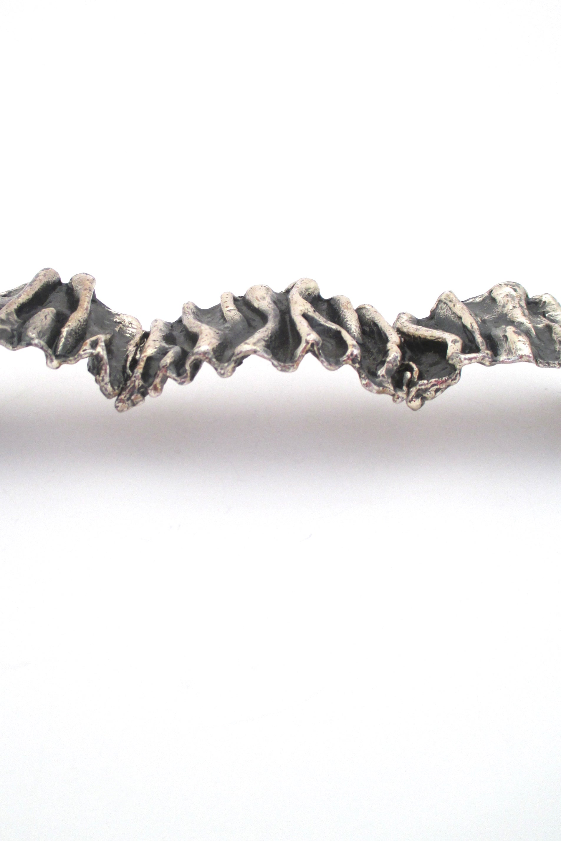 profile Guy Vidal Canada large brutalist pewter gathered folds hinged bracelet