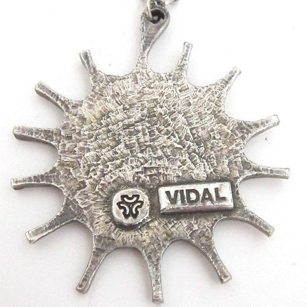 Guy Vidal four seasons sun pendant