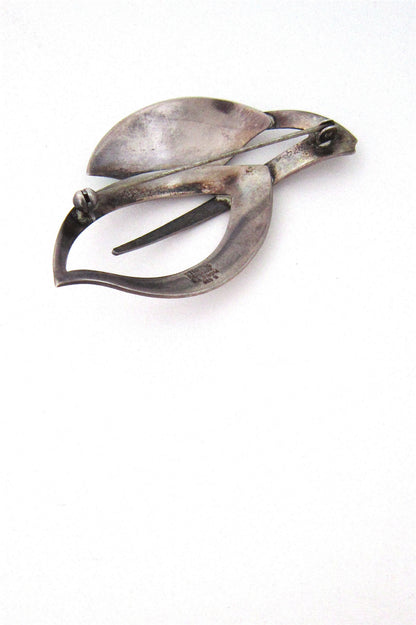 N E From enamelled leaves brooch