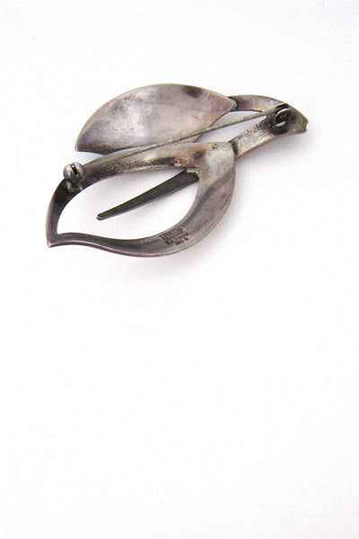 N E From enamelled leaves brooch