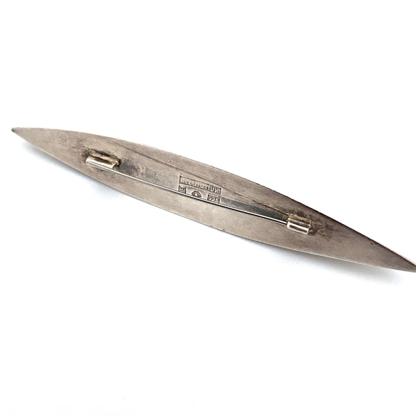 Marcin Zaremski long, sleek silver brooch