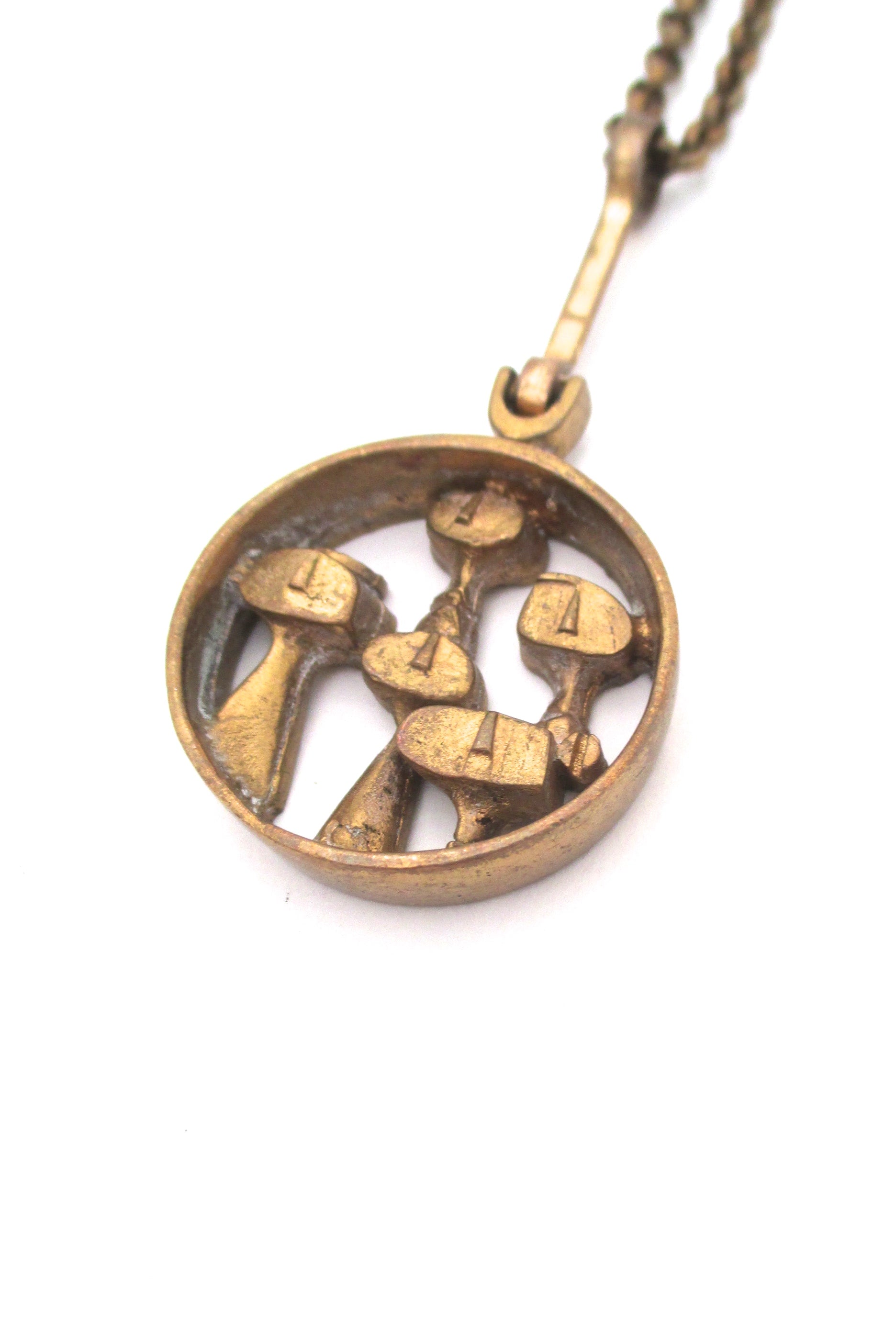 detail Jorma Laine Finland vintage bronze brutalist people pendant necklace faces in a crowd