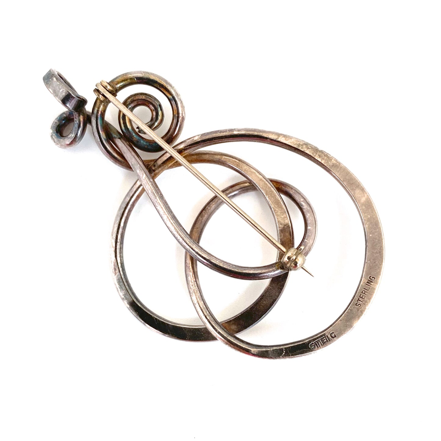Henry Steig large 'silver swirls' pendant / brooch