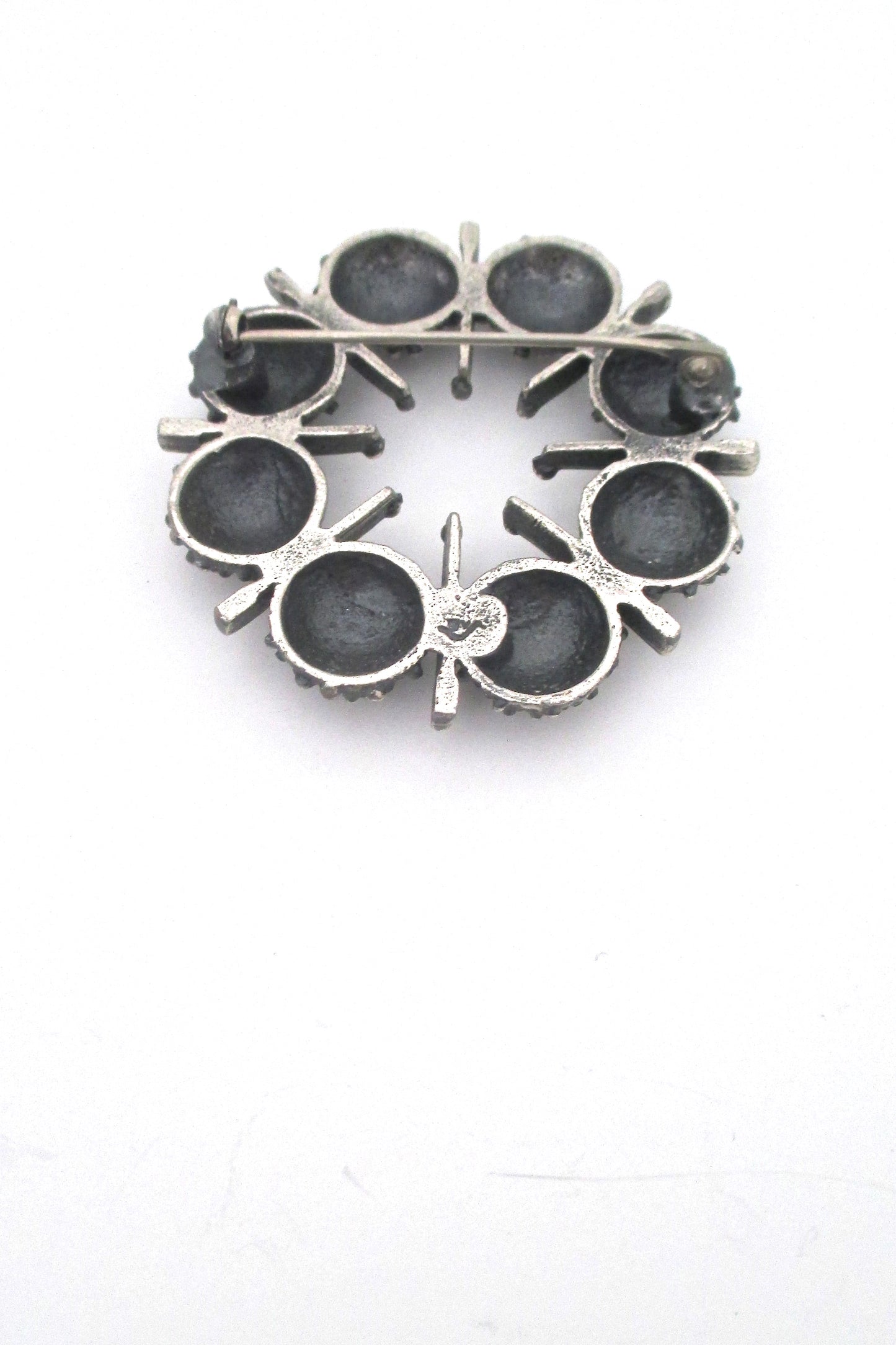 Guy Vidal openwork round pewter brooch