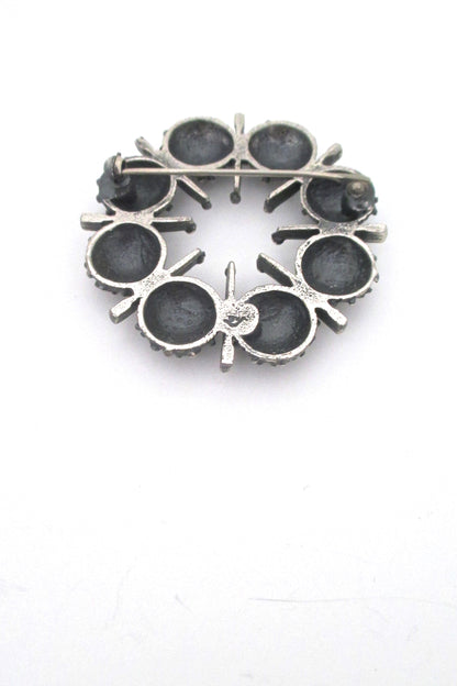 Guy Vidal openwork round pewter brooch