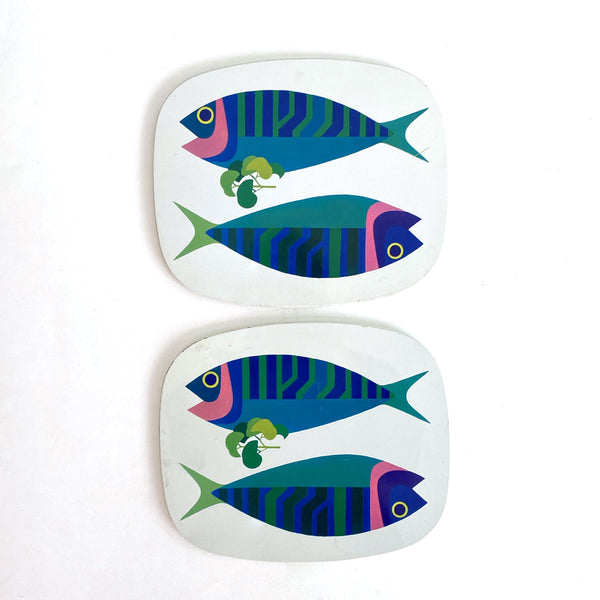 detail vintage metal and cork fish graphic trivets made in England mid century