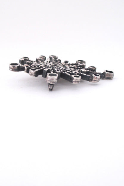 Guy Vidal pewter 'fireworks' brooch